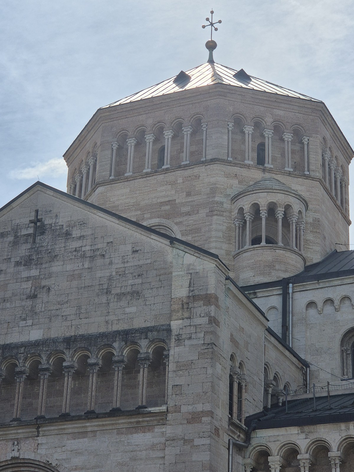 Rounded stone church building with layered masonry